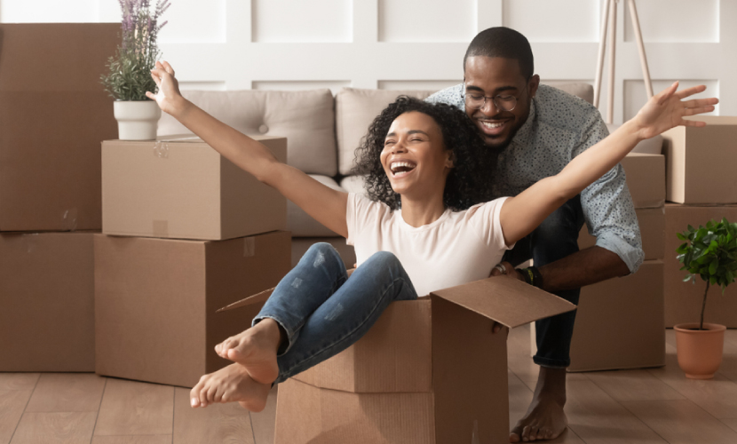 “First-time buyers statistics: 2023” in bold black text on an orange background with an image of a couple moving into a new home